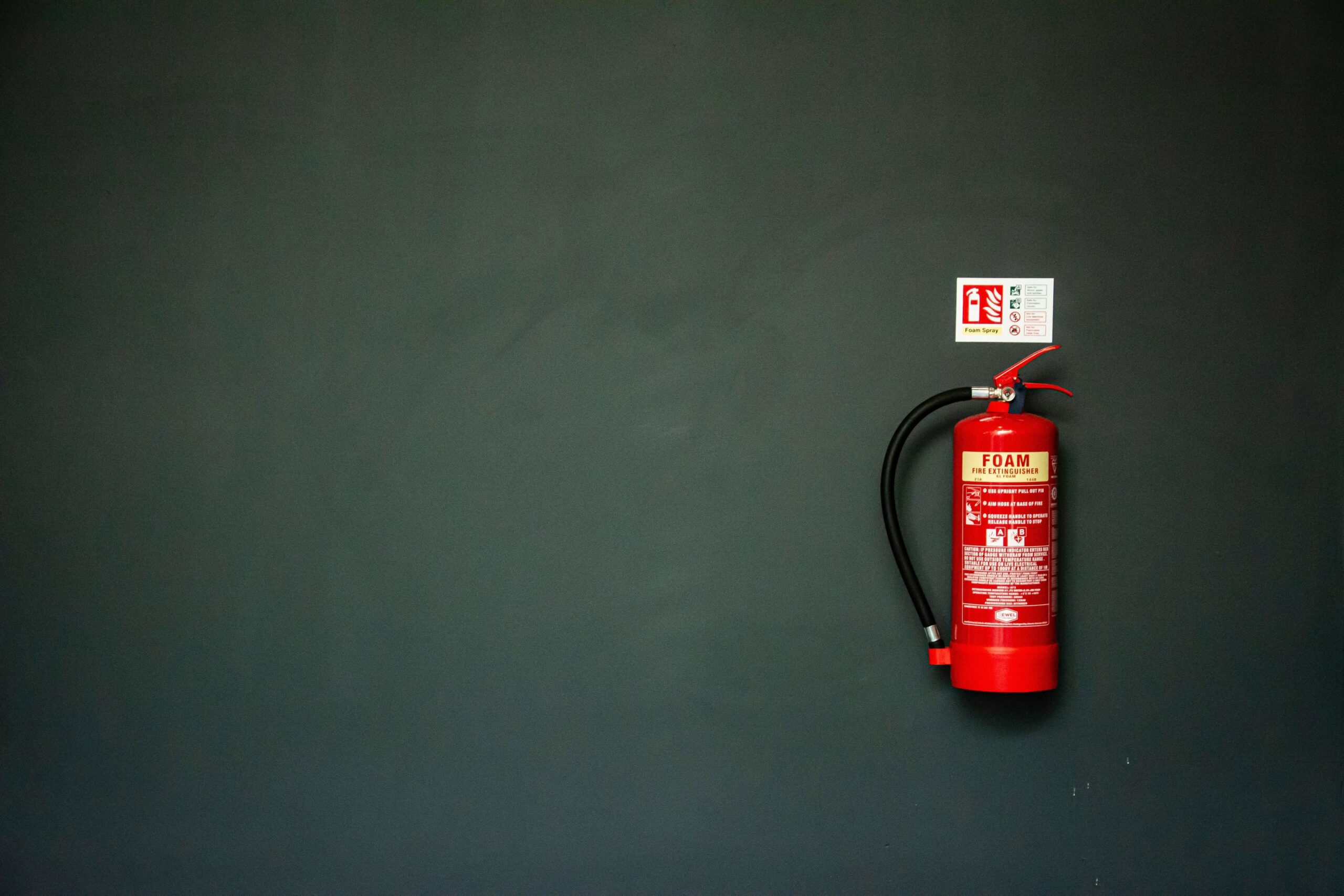 Placement and access matter as much as extinguisher type in a real incident. This Fire extinguisher placement on a wall showing accessible placement for electrical fire response.