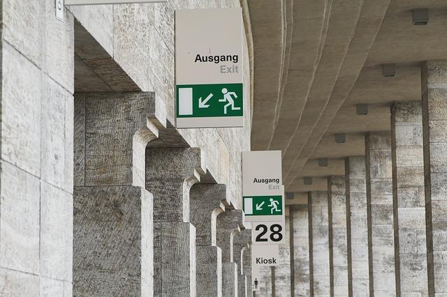 Emergency exit signage clearly displayed inside a commercial building